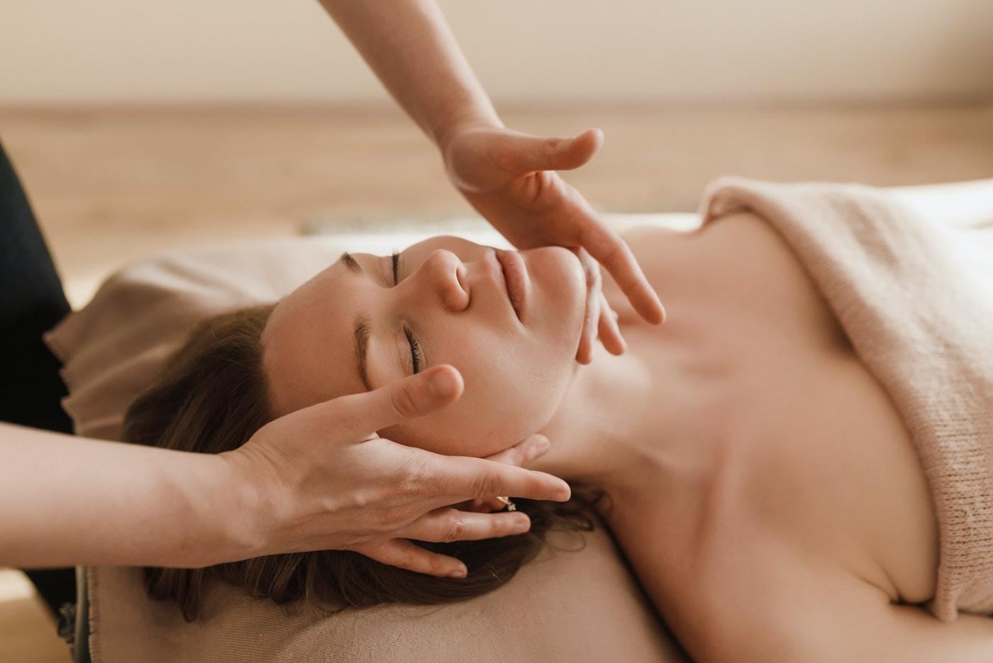 A woman getting a massage in a spa.